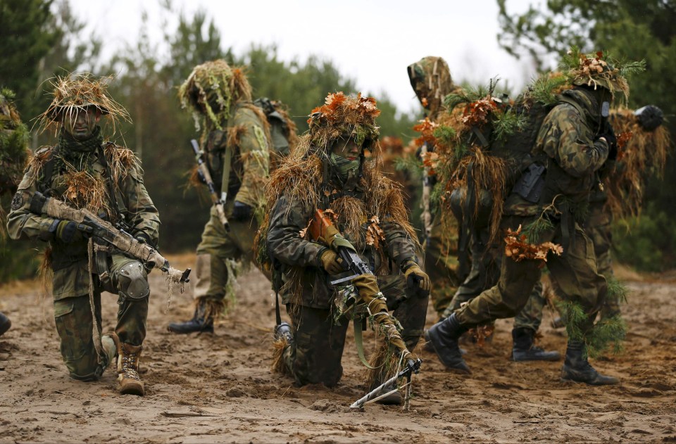 A volunteer during territorial defence training organised by SJS Strzelec (Shooters Association), paramilitary group in the forest near Minsk Mazowiecki, eastern Poland 