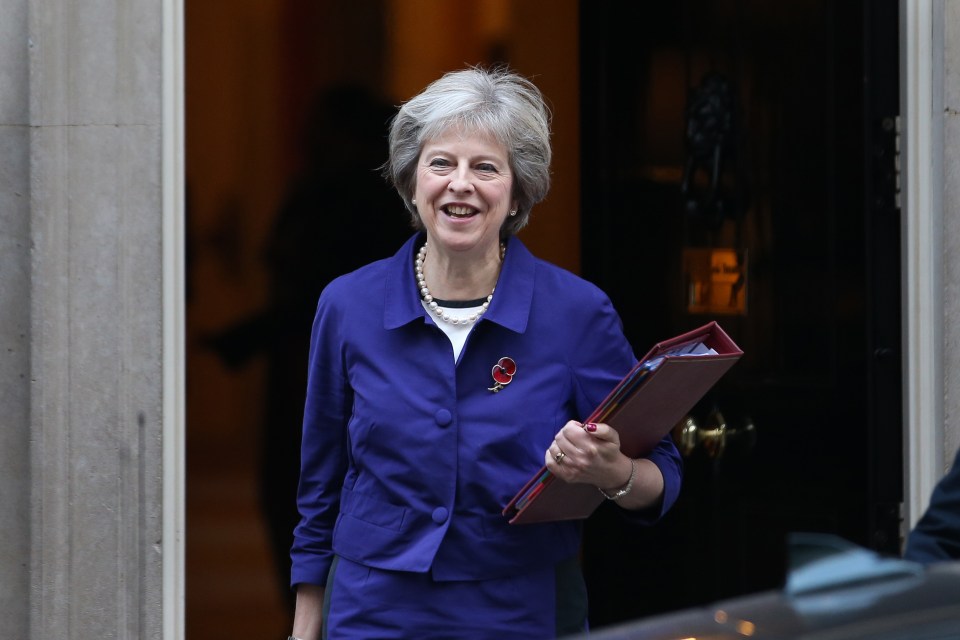 British Prime Minister Theresa May (L) l