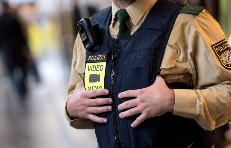 A German Police officer with a mobile body camera - police this morning arrested five suspected ISIS members