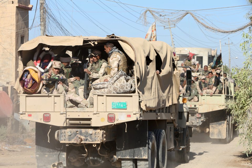 Army trucks ferry families out of the city to safety