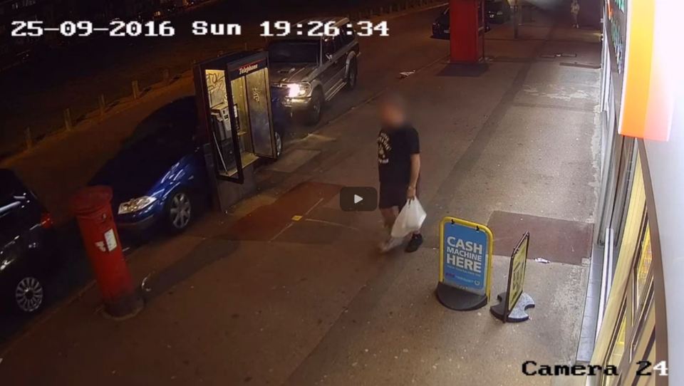 The Jeep drives straight into a row of parked cars in front of a horrified pedestrian