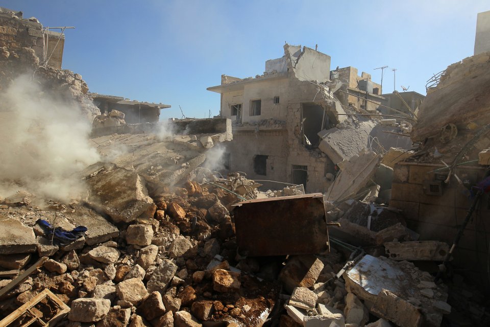 Smoke rising from damaged buildings after an airstrike on the rebel-held town of Darat Izza, Aleppo