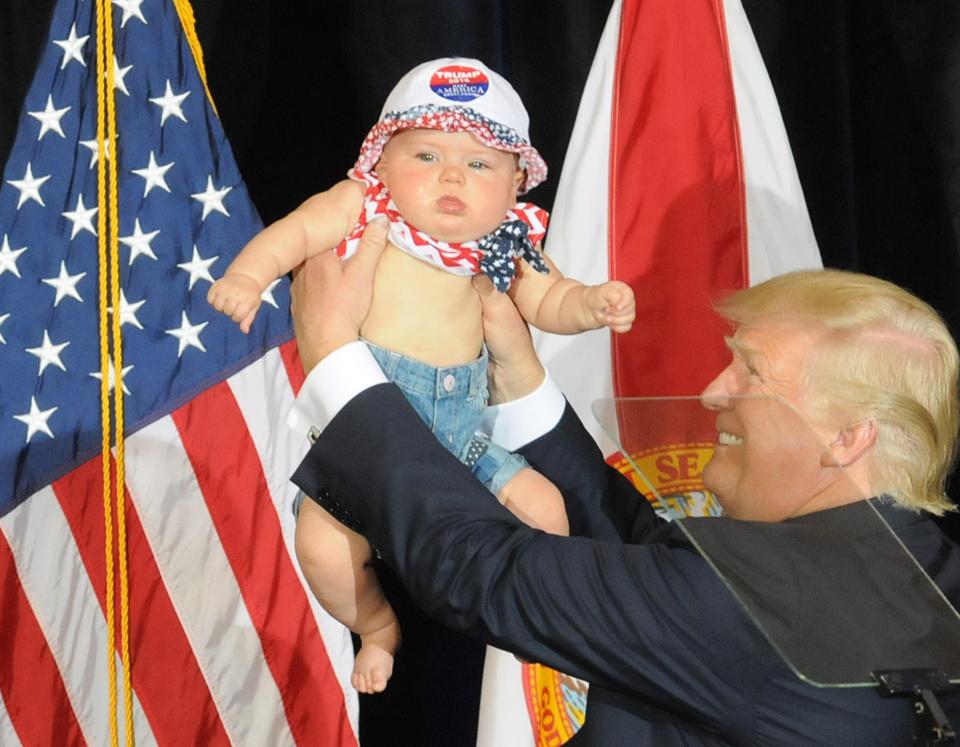 Tampa, United States. 05th Nov, 2016. November 5, 2016 - Tampa, Florida, United States - On the final weekend before the presidential election, Republican presidential nominee Donald Trump holds a baby while speaking at a campaign rally at the Florid