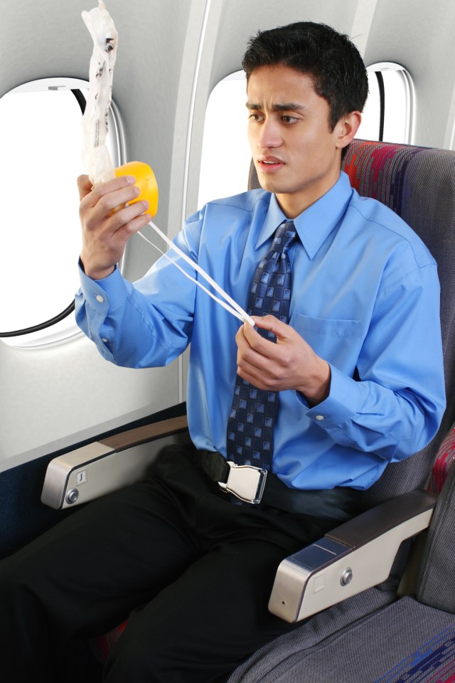 Young male looking concerned at the oxygen mask