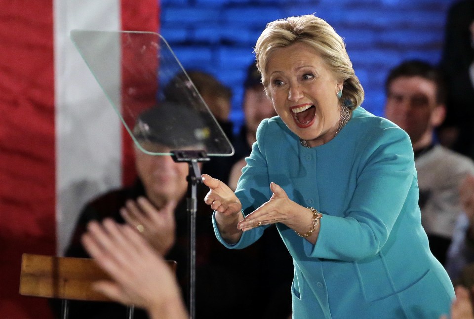 Democratic presidential candidate Hillary Clinton gestures as she takes the stage during a campaign rally Sunday