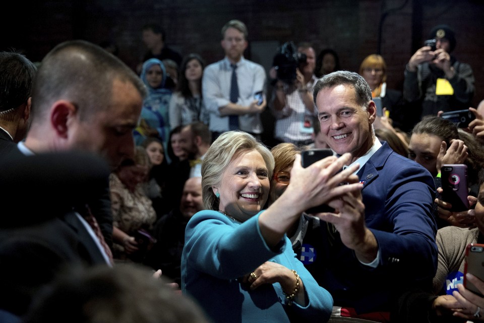 Hillary Clinton takes a selfie with a supporter