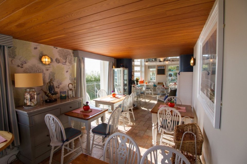 he picturesque Bluebirds Cafe sits atop the White Cliffs of Dover, with panoramic views of the Channel