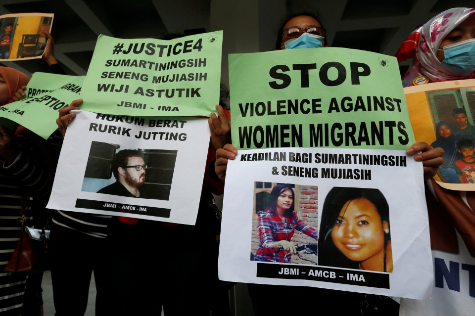 Members from a migrant workers group protested against British banker Rurik Jutting outside the High Court during his double murder trial