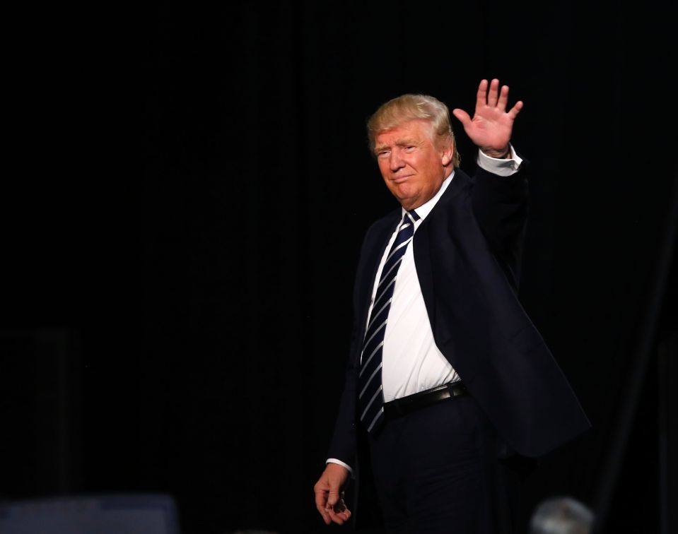 US Republican presidential candidate Donald Trump waves to crowds