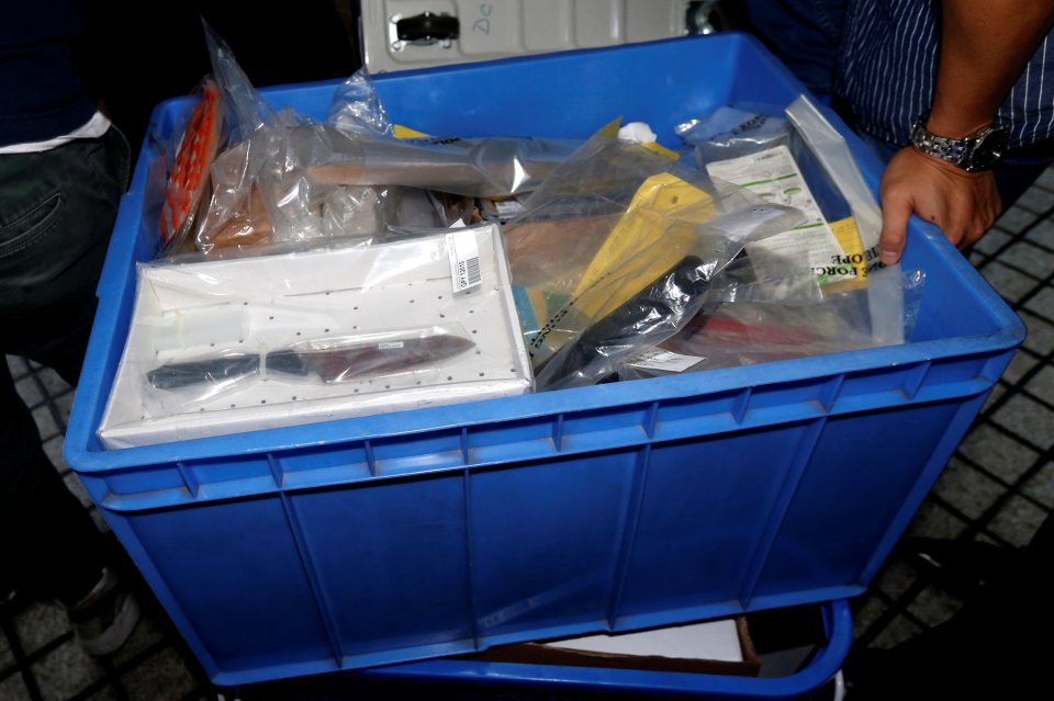 The box of evidence was pictured after he was found guilty of murder today