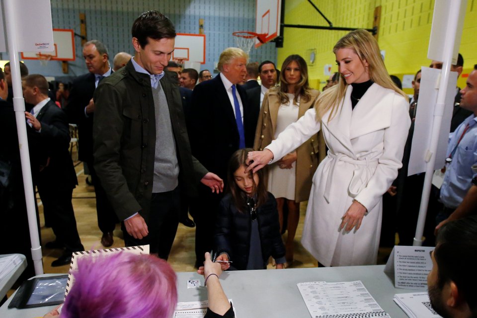 Republican presidential nominee Donald Trump's daughter Ivanka Trump brushes the hair off her daughter Arabella Kushner's face as husband Jared Kushner looks on before voting at PS 59 in New York