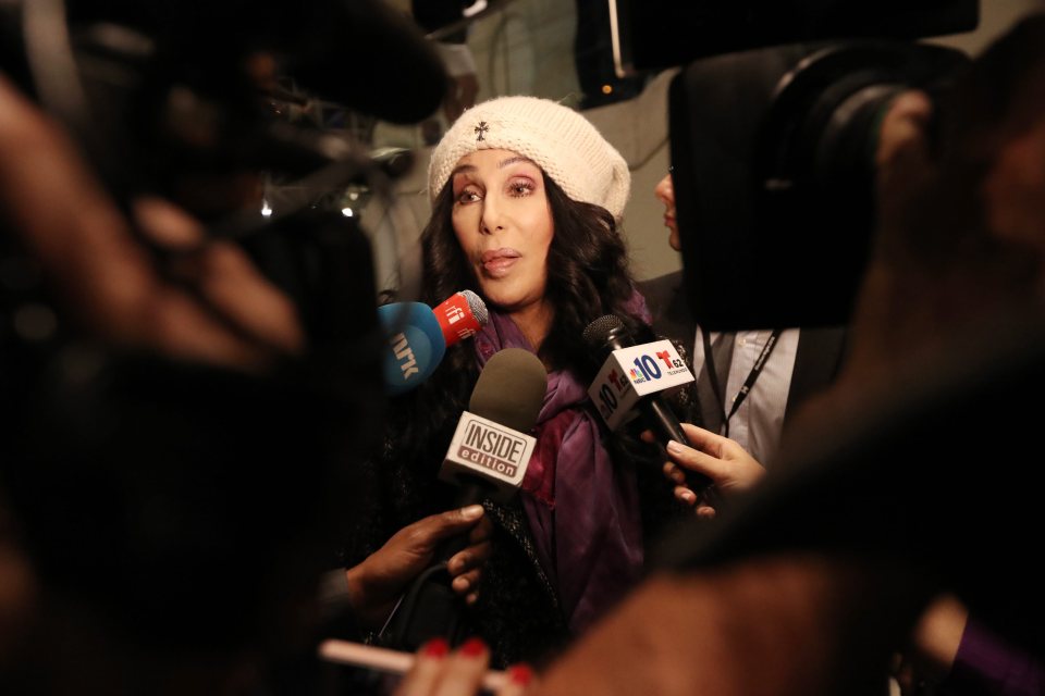 Cher looks downcast as she speaks to reporters at Hillary Clinton's election night event
