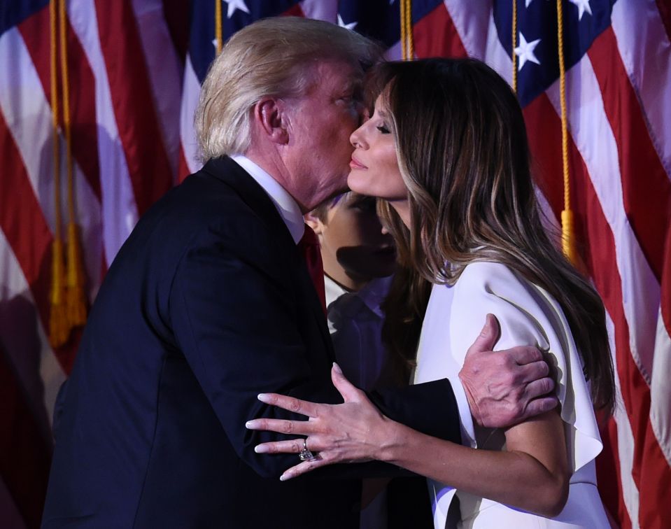 Trump kisses his wife Melania on stage as he makes his victory speech