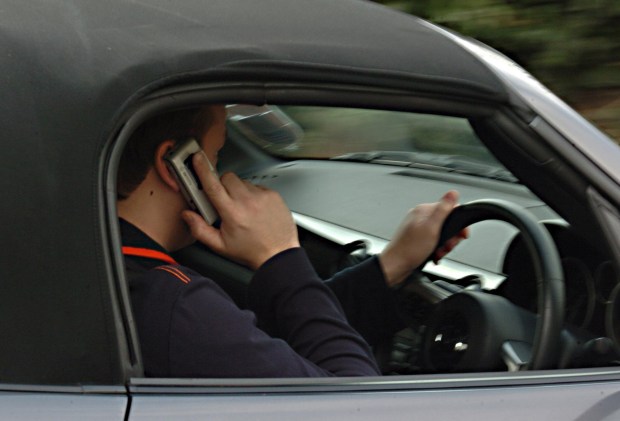 The cheeky driver claimed he had to use his phone to console his friend about the US election result