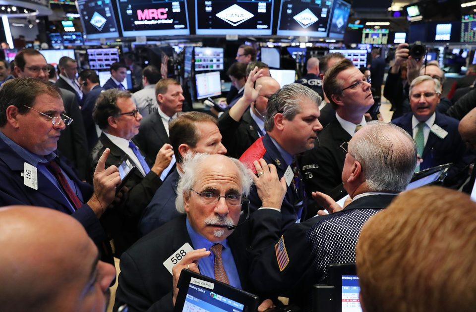 Traders work on the floor of the New York Stock Exchange (NYSE) the morning