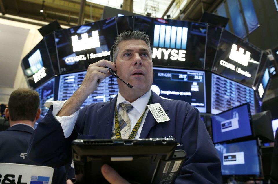 A trader watches in anticipation on the day America got a new president-elect