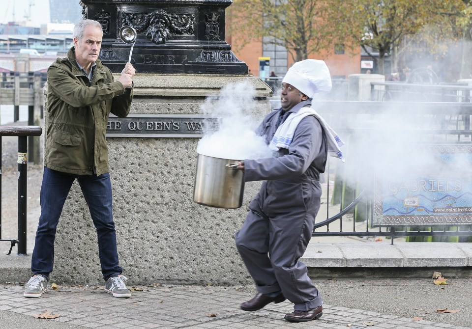 A comedy chef dashes past Phil Vickery with a steaming pot