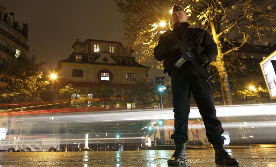 A policeman stands guard over the Bataclan concert hall, where Sting performed to commemorate the one year anniversairy of the deadly Paris attacks