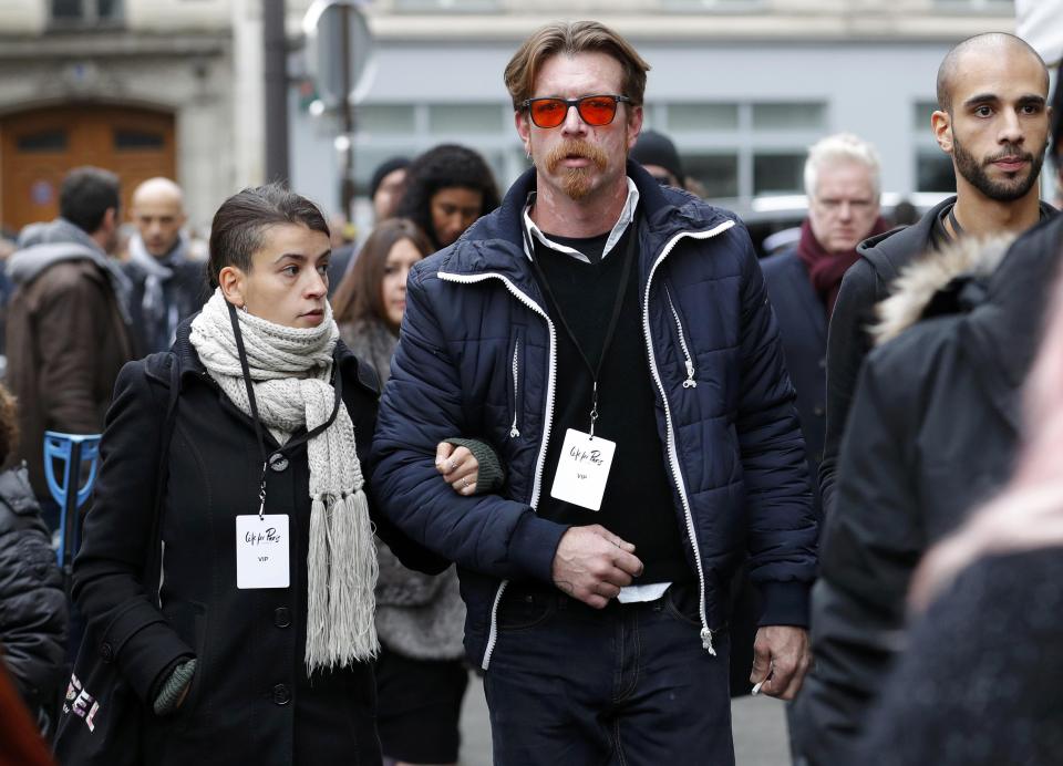 Jesse Hughes (C), member of Eagles of Death Metal band, and relatives arrive at Paris 11th district town hall