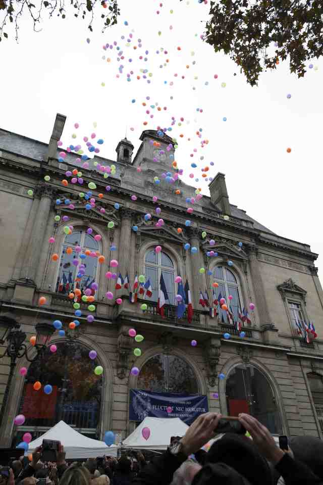 Balloons are released in front of Paris 11th district town hall