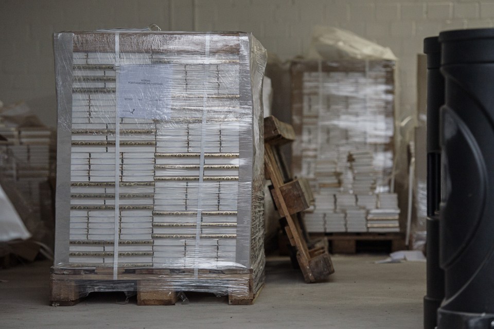 German-language copies of the Quran sit in a storage facility of the "Lies! Verlag Gesellschaft" in Pulheim near Cologne, western Germany, Tuesday, Nov. 15, 2016 when hundreds of police officers searched about 190 offices, mosques and apartments of members and supporters of the Islamic group ¿The true religion¿ after the German government announced a ban of the organisation today