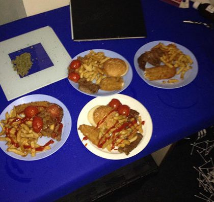 Inmates enjoy burgers and fish and chips in their cell along with suspicious looking substance top left