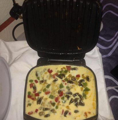 Brazen inmates are even pictured cooking in their cell