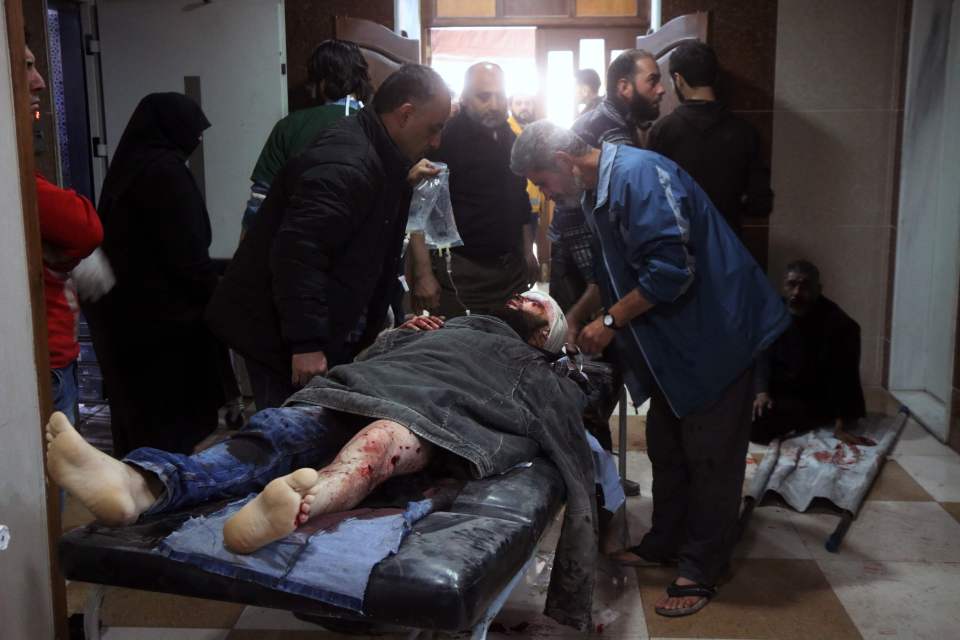 A wounded Syrian receives treatment at a
