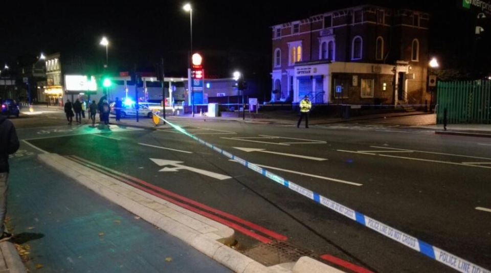 Bow Road in East London is sealed off after a plain clothes cop was stabbed near the Bow Bells pub