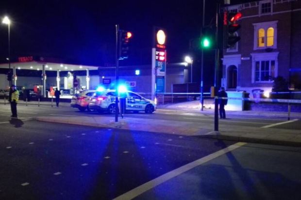 Bow Road in East London is sealed off after a plain clothes cop was stabbed near the Bow Bells pub