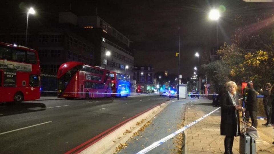 Bow Road in East London is sealed off after a plain clothes cop was stabbed near the Bow Bells pub