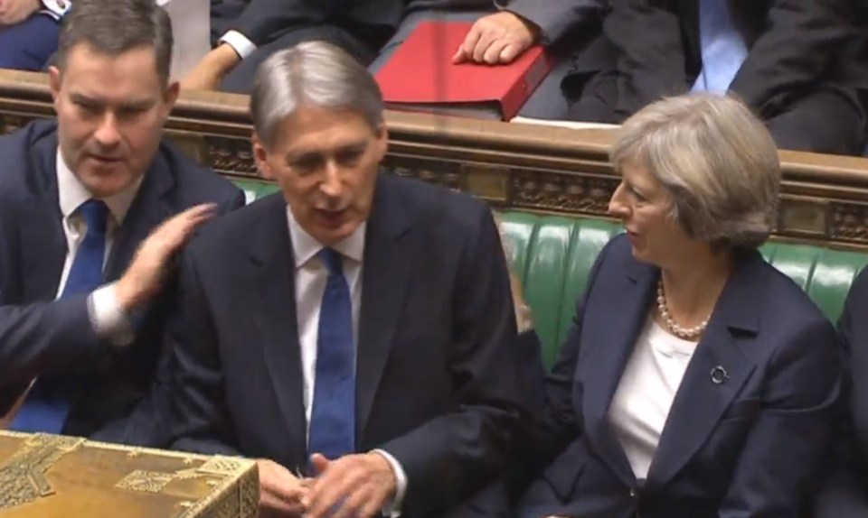 The Prime Minister Theresa May congratulates Mr Hammond after he delivered his Autumn Statement