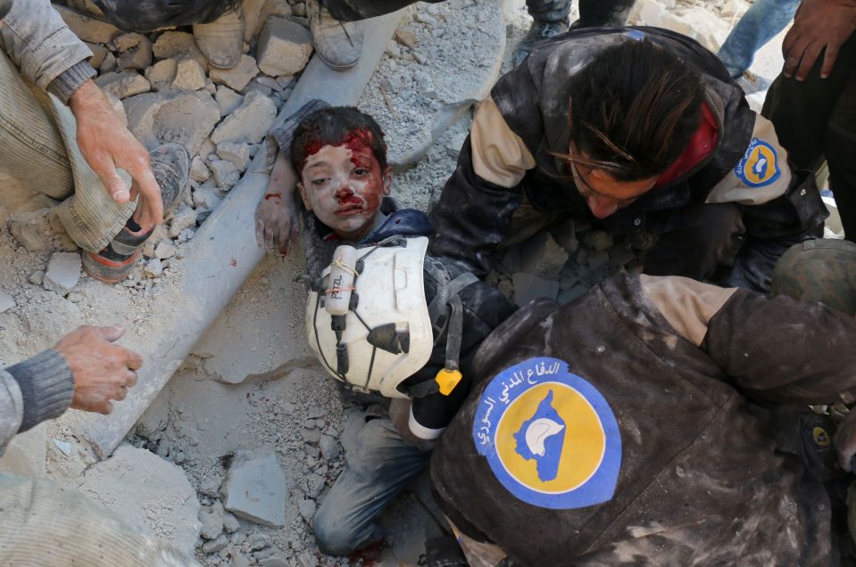 The lad, who looks no older than ten, was rescued by the White Helmets