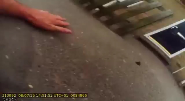 The traffic warden is left on the ground while the man leaves the scene