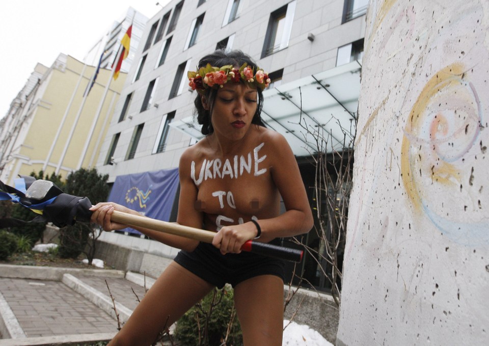 The woman had "Ukraine to EU" written on her chest