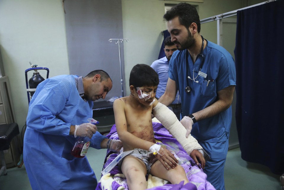 A young lad is treated by doctors after being injured in the horrific fighting for the Iraqi city of Mosul