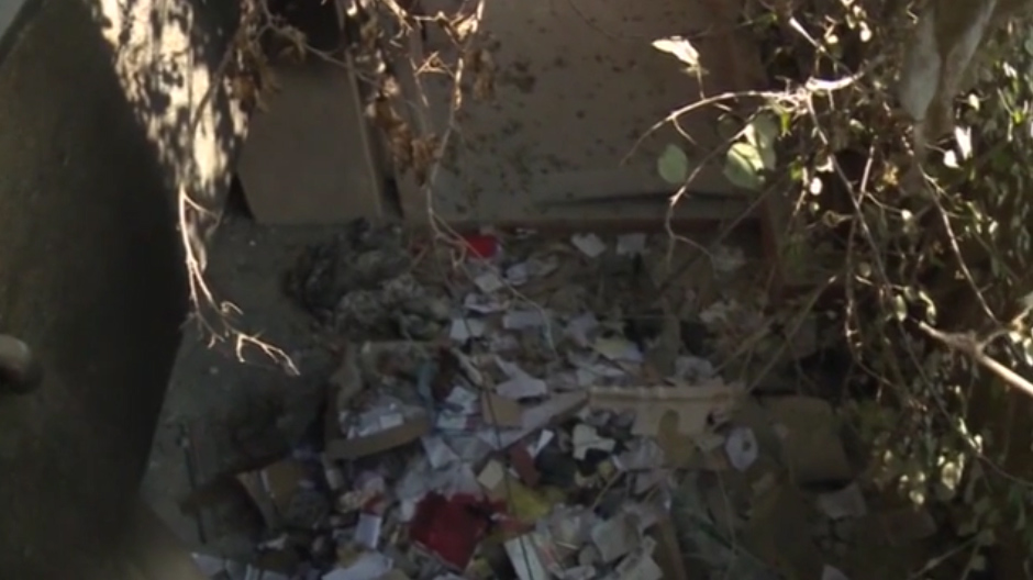 Smashed glass was littered over the floor of the jail which was disguised to look like other houses on the street