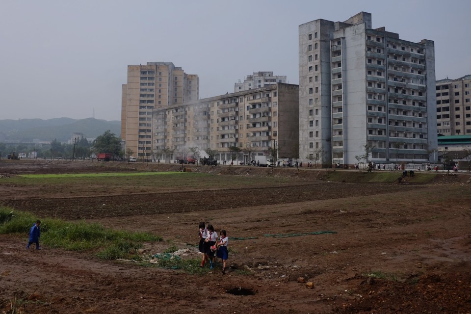 Schoolchildren on their way home in provincial Pyongsong, known as the 'City of Scientists'