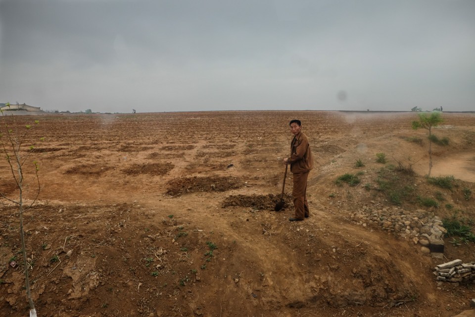 Despite the heavy skies, this farmer was facing the prospect of drought - a major problem in the impoverished country