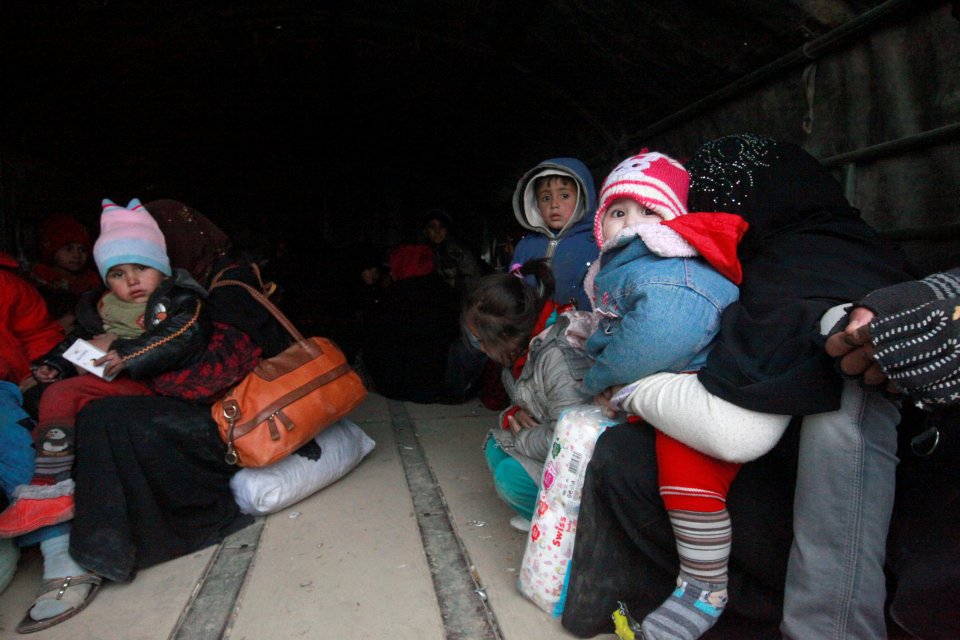 Displaced people who fled the clashes transfer to camps during a battle with Islamic State militants in Mosul