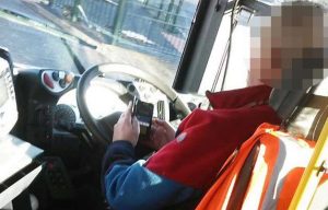 Bus driver caught using mobile phone while driving is suspended
