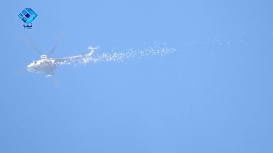 Russian chopper dropping leaflets on Aleppo warning of imminent attack
