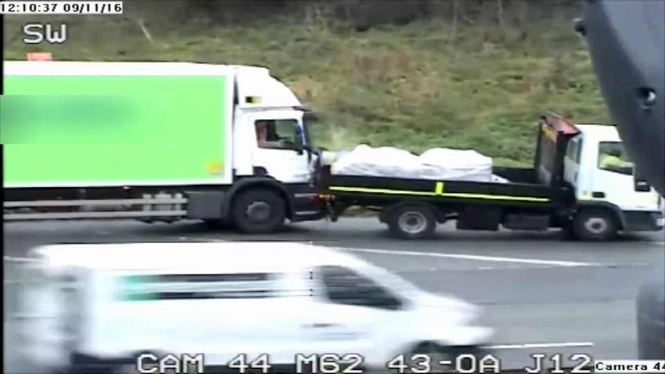  Pick-up driver reverses into cab of lorry as the terrified pair inside look on
