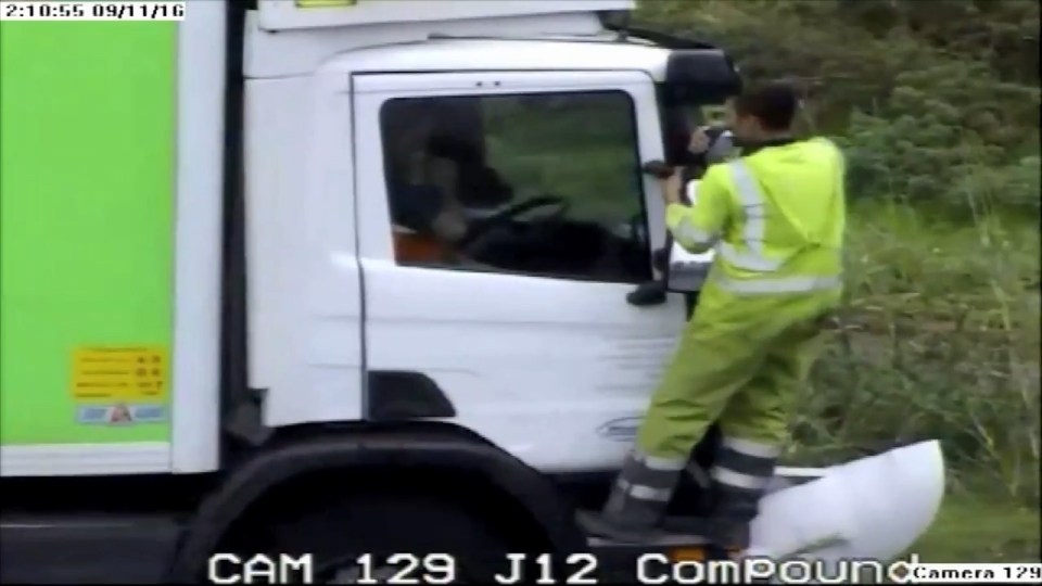  Road rage thug hangs off the wing mirror of lorry's cab