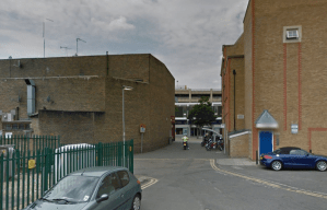 A man has reportedly been stabbed in the mouth in an alleyway off Redhill High Street