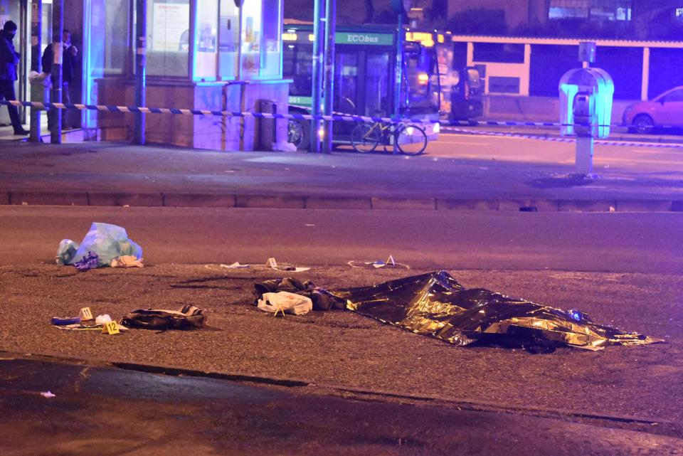  Amri lies dead in the street after being gunned down in Milan