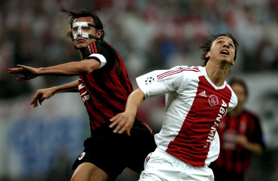 ANP05 - 20030423 - MILAN, ITALY : Paolo Maldini (L) of AC Milan with protective face mask and Zlatan Ibrahimovic of Ajax Amsterdam clash during their UEFA Champions League match in Milan, 23 April 2003. EPA PHOTO ANP/OLAF KRAAK/lln mda