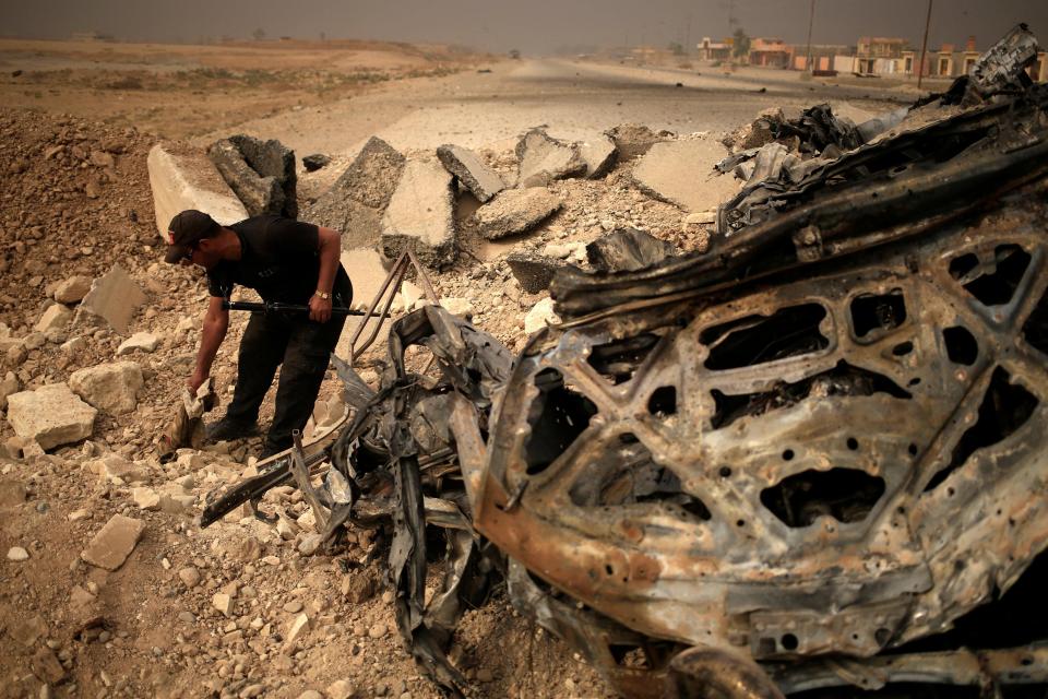  A member of Iraqi special forces at the site of a suicide attack east of Mosul