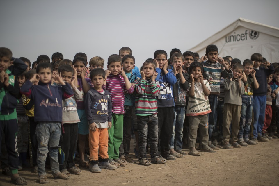 Children who fled the fighting in Mosul are seen here at a refugee camp in Hassan Sham