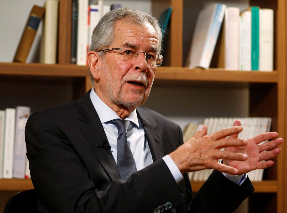 Austrian presidential candidate Alexander Van der Bellen, who is supported by the Greens, gestures during an interview 